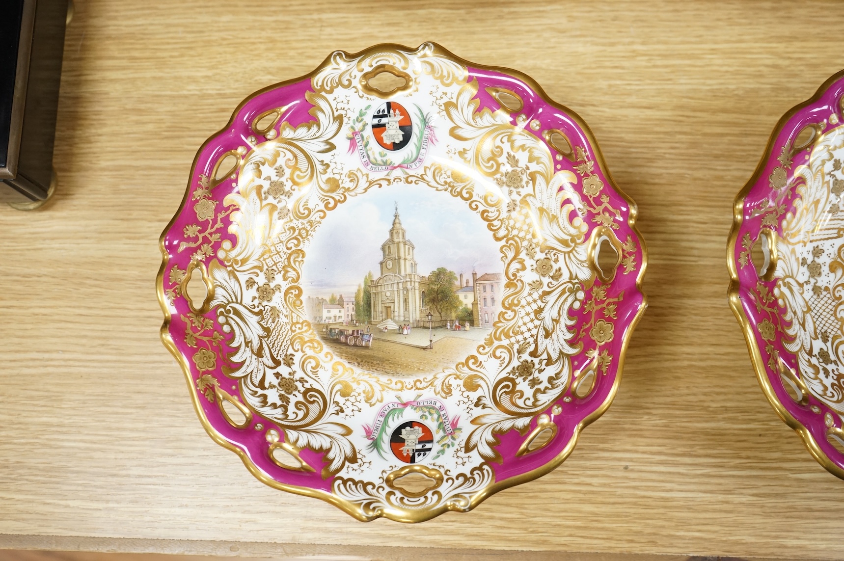 Four G Grainger, Worcester armorial porcelain comports, c.1845, hand painted with named views of Worcester, 24cm in diameter